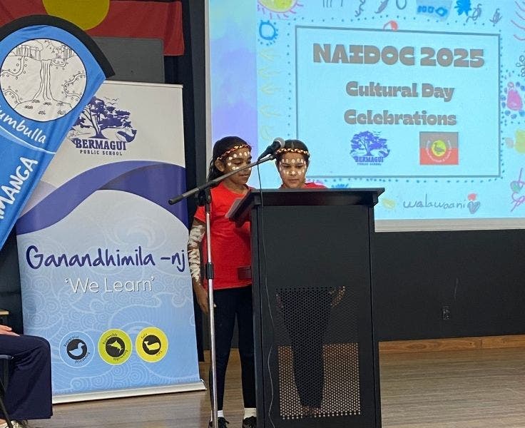 Students at our NAIDOC assembly doing the 'Welcome to Country' on stage