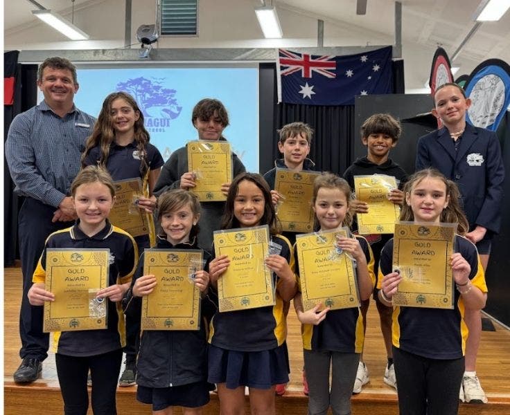 Photo of students with the gold award at our award presentation assembly